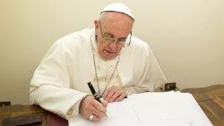 FIle photo of Pope Francis writing