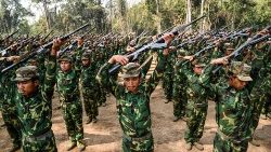 Members of ethnic rebel group Ta'ang National Liberation Army take part in a training exercise