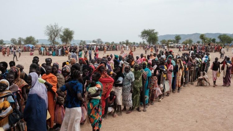 People line up to register for a potential food aid delivery at a camp for internally displaced persons in Agari, North Kordofan, Sudan