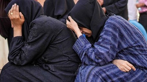 Women mourn the loss of their family members after Israeli bombardment in al-Maghazi, Gaza 