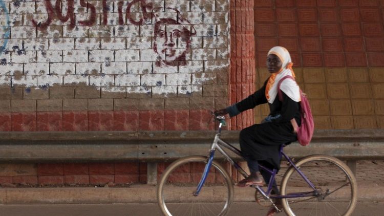 Burkina Faso student on a bike.