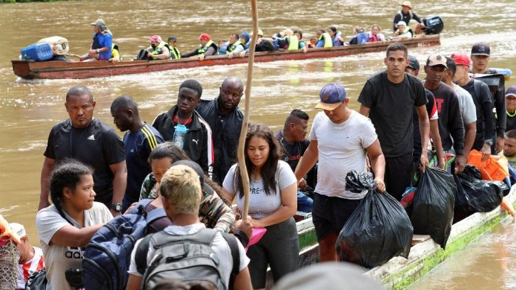 Migrants arrive at a reception station in Panama