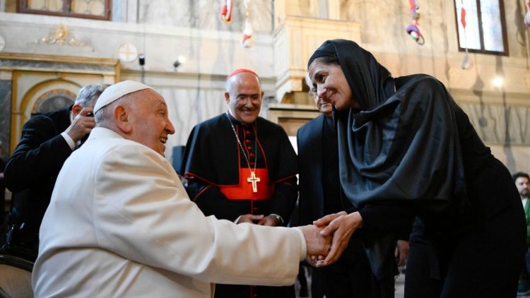 Pope Francis greets an artist of the Venice Art Biennale