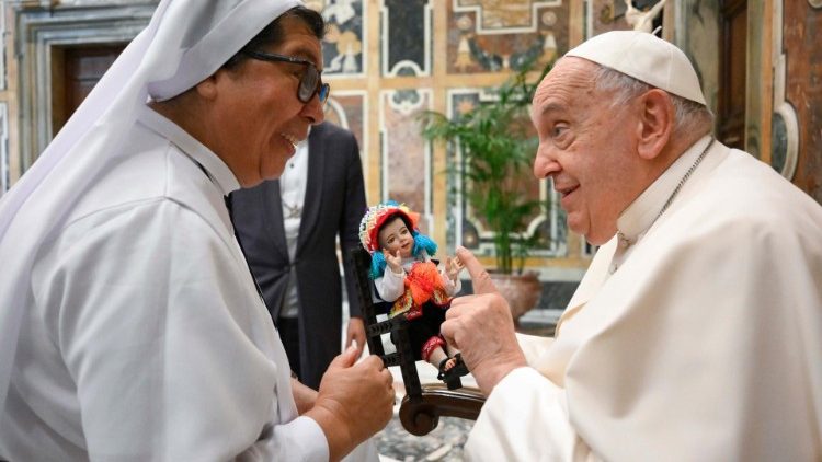 Pope Francis greets a religious sister during his meeting with consecrated men and women