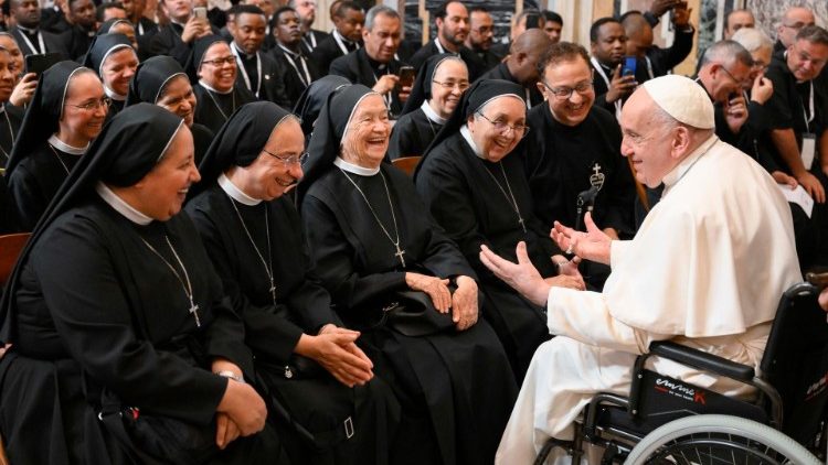 Pope Francis chats with several religious at the audience on Monday