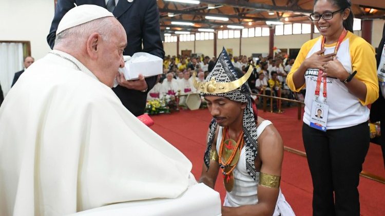 A young Timorese man greets Pope Francis