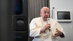 Pope Francis speaks with journalists aboard the return flight from Singapore