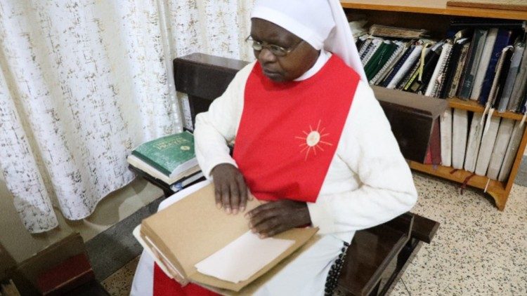 Sr. Mary Veronica during morning prayer using braille