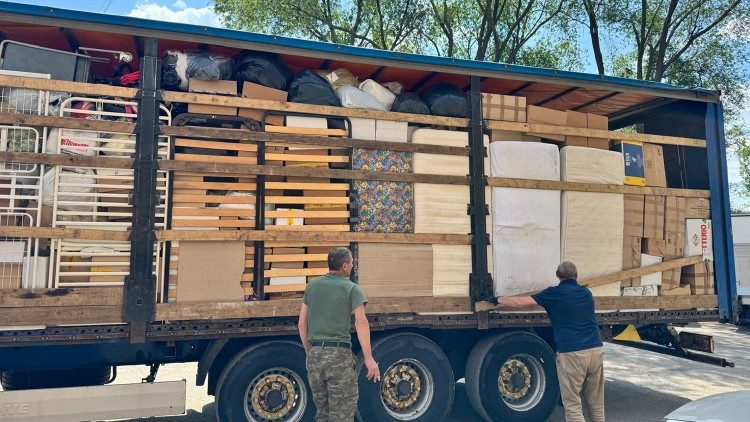 Trucks are loaded with food aid for the people of Ukraine