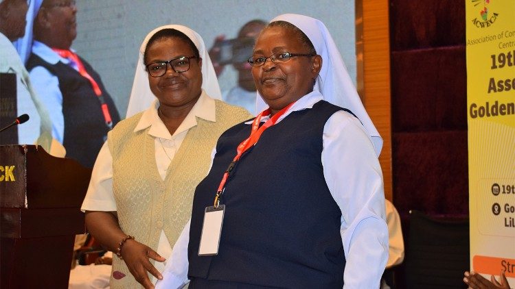 Sr Rosalia Sakayombo (left, in Beige habit) with new ACWECA President, Sr Grace Kyomugisha 