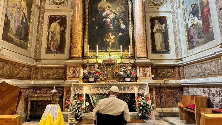 Pope Francis prays before the "PIlgrim's Madonna" in the Church of Saint Augustine