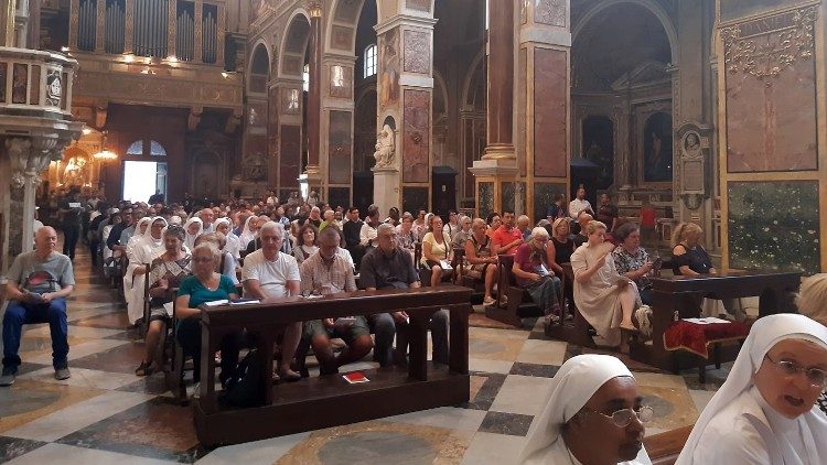 The Basilica of St. Augustine in Rome crowded with believers