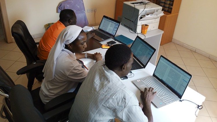 Sister giving computer training lessons to students in Nigeria