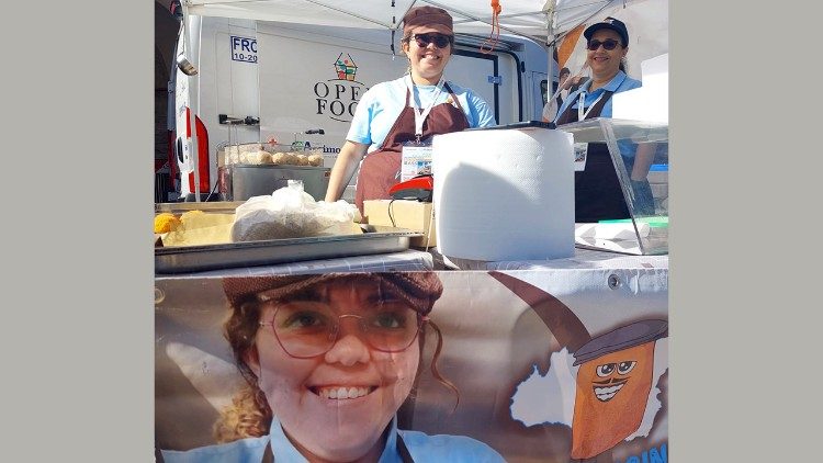 Young people staff the N'Arancina food stand in Assisi