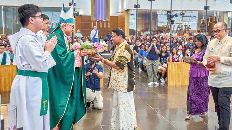 Representatives from various migrant communities present the gifts to Cardonal Willaim Goh during the Offertory at the Mass. Photo credit: VITA Images and Marcus Chung via Catholic News SG