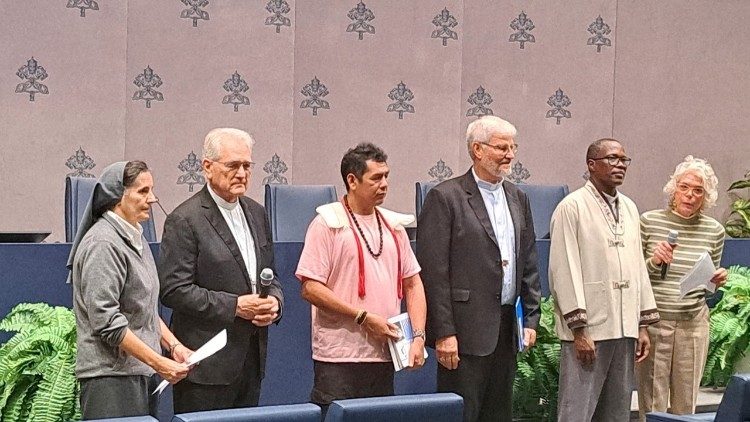 The speakers at the meeting point ahead of the canonizations