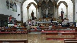 Floodwaters inundate Polangui Parish Church in the Diocese of Legazpi, yet it remains open to nearly 300 evacuees seeking shelter. Photo by Diocese of Legazpi