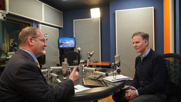 Juan Carlos Cruz, right, speaks with Vatican News about the Pilot Annual Report on Safeguarding