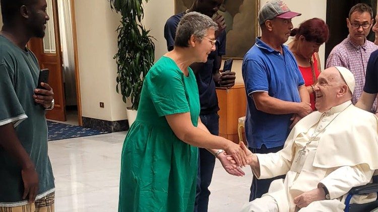 Pope Francis greets the group at the Casa Santa Marta