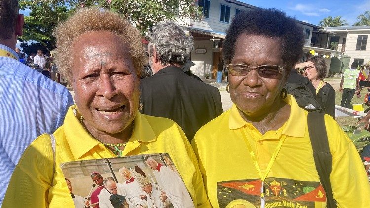 Carol and a relative with the photo and medallions