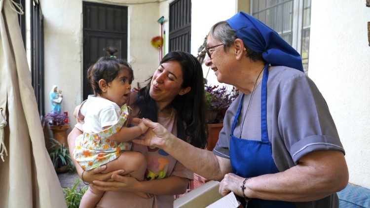 Sister Magdalena Smet with residents of Dbayeh camp