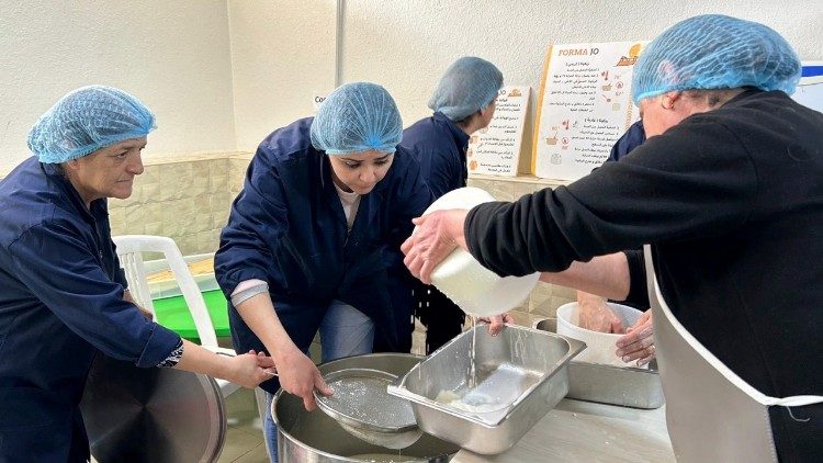 Ladies producing cheese in Adir