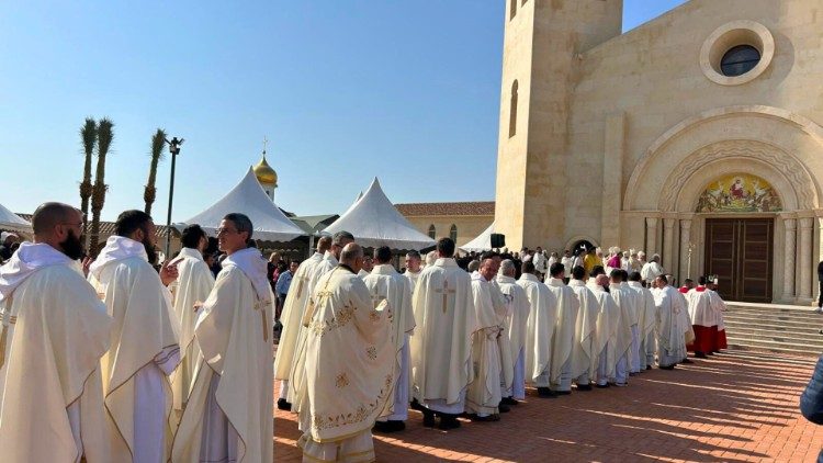 Priests prepare to process into the Church of the Baptism of the Lord at the Jordan River